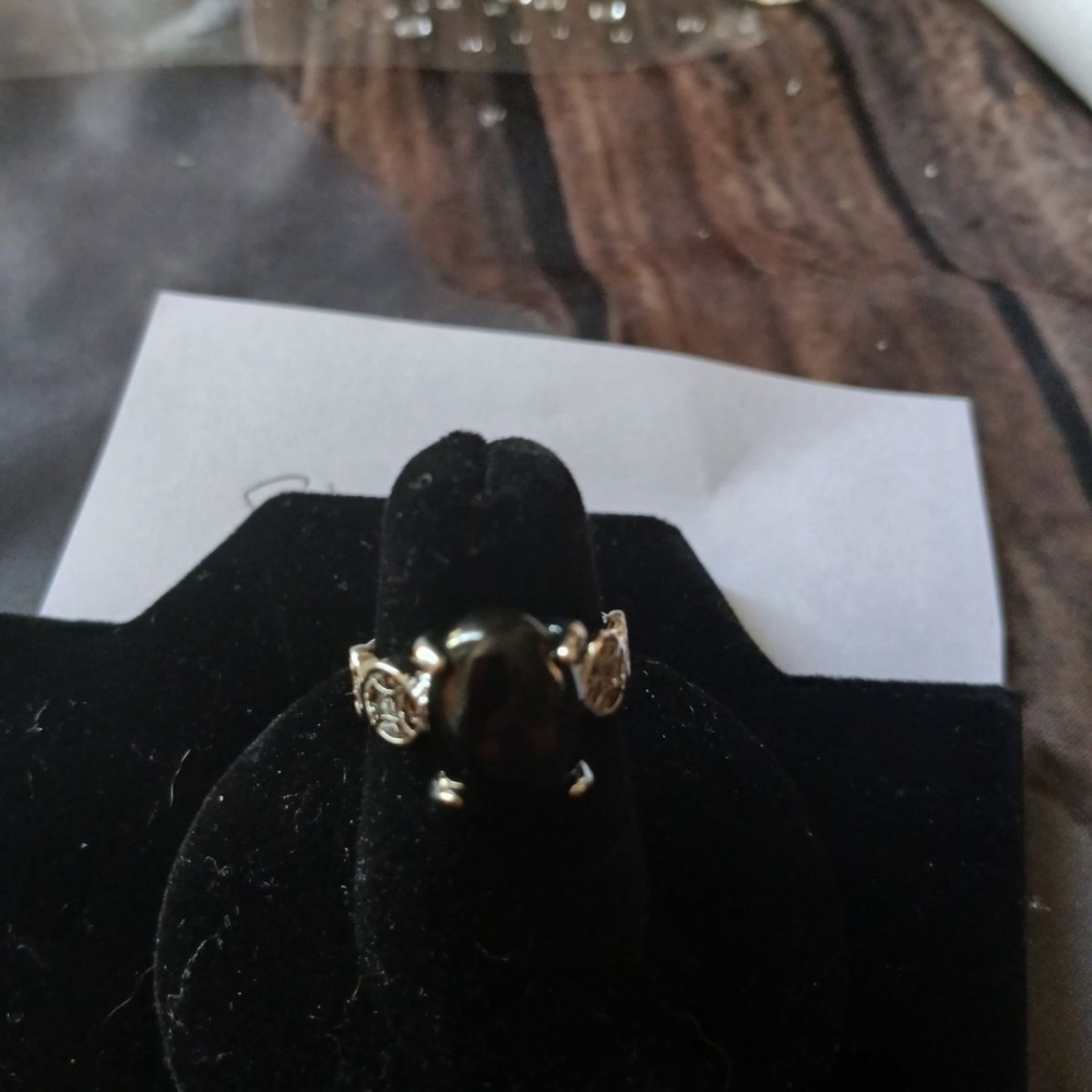 Silver ring with black stone on  Celtic band